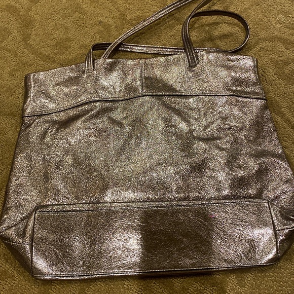 Coach tote iridescent color. Stains in the inside. Comes with dust bag - Picture 2 of 3